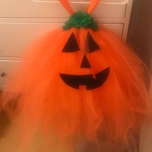 Two beautiful, hand-made, little girls pumpkin costumes.